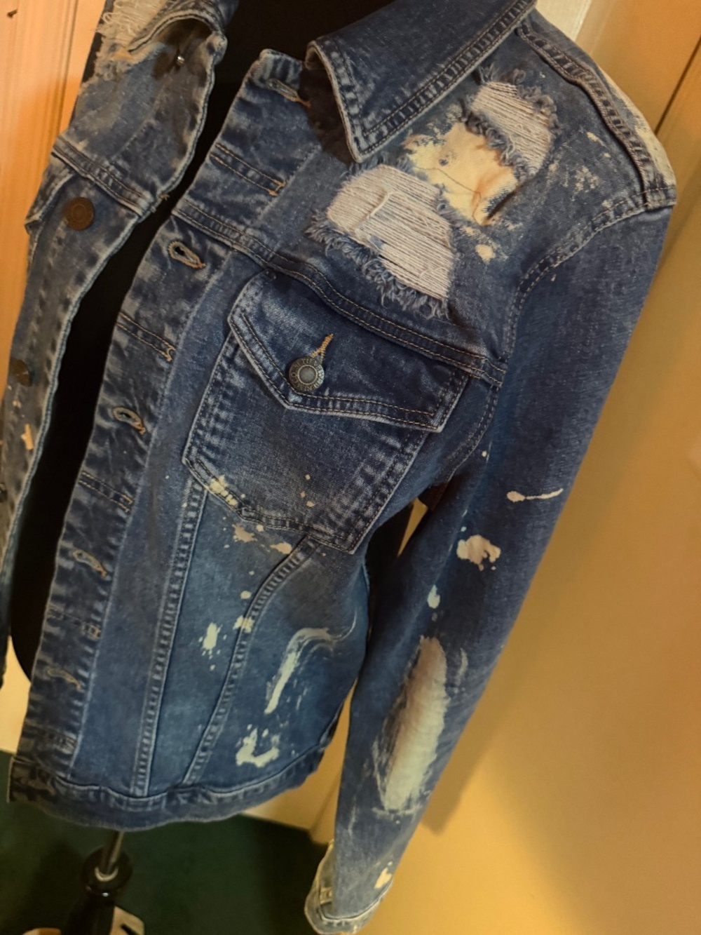 Distressed denim jacket